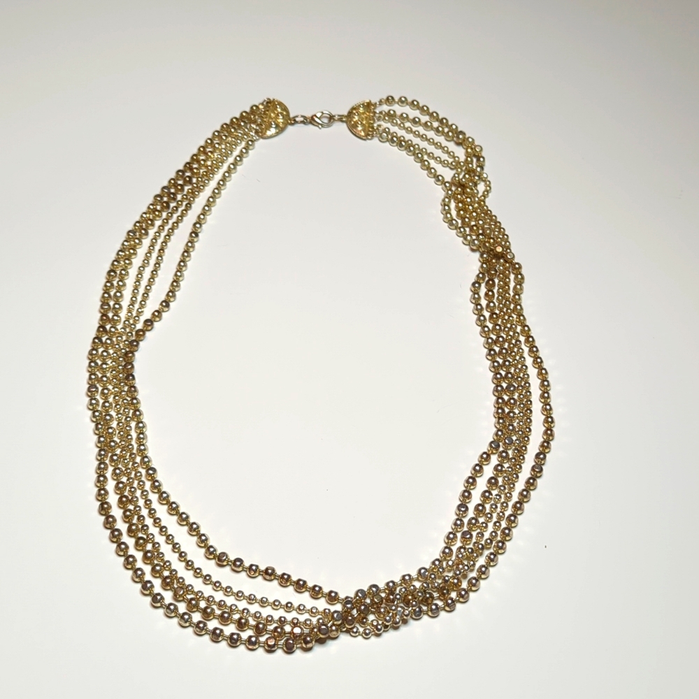 Graduated multi-string necklace